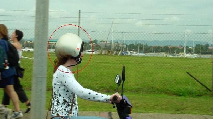 woman wears helmet backwards