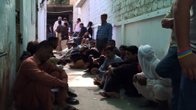 People made to sit on the floor out in corridor as the branch goes on a lunch break. Xermesh Patel, Facebook.
