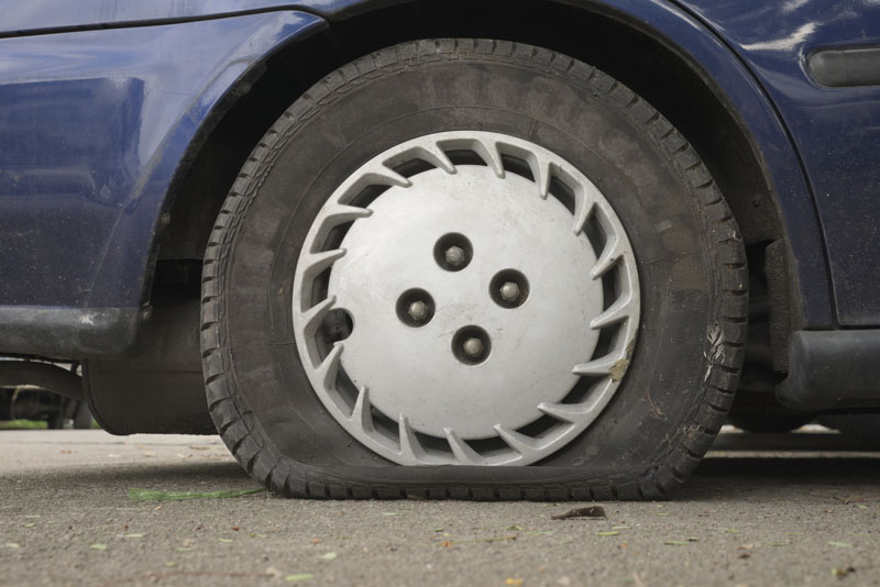 symbolic meaning of a flat tire