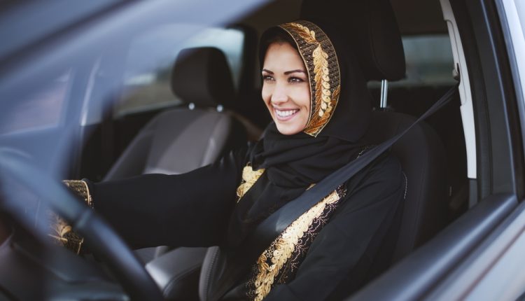 Gorgeous,Smiling,Muslim,Woman,Dressed,In,Traditional,Wear,Driving,Her